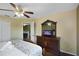 Bedroom with a king-size bed and built-in TV at 151 Rubino Dr, Davenport, FL 33837