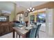 Bright dining area with table and chairs, overlooking the pool at 151 Rubino Dr, Davenport, FL 33837