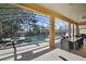 Screened-in pool area with patio furniture and canal view at 151 Rubino Dr, Davenport, FL 33837