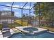 Screened-in spa with comfortable seating and water toys at 151 Rubino Dr, Davenport, FL 33837