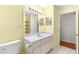 Bright bathroom with single sink vanity and linen storage at 17329 Se 115Th Terrace Rd, Summerfield, FL 34491