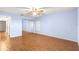 Light and airy bedroom with mirrored closet and wood floors at 17329 Se 115Th Terrace Rd, Summerfield, FL 34491