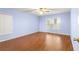 Spacious bedroom featuring light walls and wood flooring at 17329 Se 115Th Terrace Rd, Summerfield, FL 34491