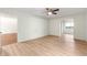 Bright bedroom with wood flooring and access to a room at 17329 Se 115Th Terrace Rd, Summerfield, FL 34491