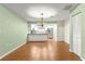 Dining room with light green walls and wood flooring at 17329 Se 115Th Terrace Rd, Summerfield, FL 34491