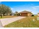 House exterior showcasing a brown garage door and a paved driveway at 17329 Se 115Th Terrace Rd, Summerfield, FL 34491