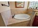 Relaxing bathroom with soaking tub and tile surround at 2126 Lake Ridge Dr, The Villages, FL 32162