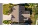 An aerial shot of a single Gathering home with a dark roof and landscaping at 2131 Callaway Dr, The Villages, FL 32162