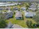 Aerial view of a house and neighborhood near a lake at 22250 Draw Bridge Dr, Leesburg, FL 34748