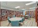 Community library with bookshelves, tables and chairs for reading at 22250 Draw Bridge Dr, Leesburg, FL 34748