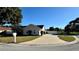 Paved driveway leading to a single-story house with attached garage at 2294 W Moonlight Ln, Eustis, FL 32726