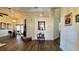 Living room with wood-look flooring, fireplace, and dining area at 2294 W Moonlight Ln, Eustis, FL 32726