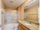 Bathroom with granite countertop and shower/tub combo at 2361 E Gaffney Ave, The Villages, FL 32162