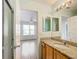 Bathroom with granite countertop and access to bedroom at 2361 E Gaffney Ave, The Villages, FL 32162