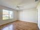 Bedroom with laminate wood flooring and large window at 2361 E Gaffney Ave, The Villages, FL 32162