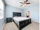 Bright bedroom with a king-size bed and ensuite bathroom at 2703 Limerick Cir, Grand Island, FL 32735