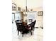 Dining area adjacent to the kitchen with a large table and seating for six at 2850 Apache Ct, The Villages, FL 32163