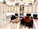 Well-equipped home office featuring wraparound desk, custom cabinetry, and ample workspace at 2850 Apache Ct, The Villages, FL 32163