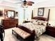 Large main bedroom with a king-size bed, ceiling fan, and ample natural light at 2850 Apache Ct, The Villages, FL 32163