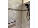 Modern walk-in shower with tile surround, handheld showerhead, and grab bars at 2850 Apache Ct, The Villages, FL 32163