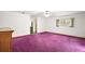 Spacious bedroom with purple carpet and ceiling fan at 34620 Galla Rd, Fruitland Park, FL 34731