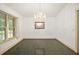 Formal dining room with chandelier and large windows at 34620 Galla Rd, Fruitland Park, FL 34731