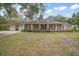 Brick ranch house with attached two-car garage at 34620 Galla Rd, Fruitland Park, FL 34731