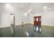 Large living room with high ceilings and dark tile floors at 34620 Galla Rd, Fruitland Park, FL 34731