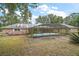 Enclosed rectangular pool with spa and patio at 34620 Galla Rd, Fruitland Park, FL 34731