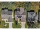 Aerial perspective of a house and neighboring properties, highlighting rooflines at 3550 Auburndale Ave, The Villages, FL 32162