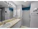 Double vanity bathroom with shower at 3550 Auburndale Ave, The Villages, FL 32162