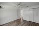Bedroom featuring wood-look floors and a closet at 3550 Auburndale Ave, The Villages, FL 32162