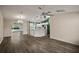 Modern kitchen with white cabinets, island, and stainless steel appliances at 3550 Auburndale Ave, The Villages, FL 32162