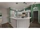Modern kitchen with white cabinets and stainless steel appliances at 3550 Auburndale Ave, The Villages, FL 32162