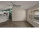 Living room with wood-look floors and ceiling fan at 3550 Auburndale Ave, The Villages, FL 32162
