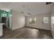 Spacious living room with wood-look floors and lots of natural light at 3550 Auburndale Ave, The Villages, FL 32162
