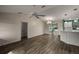 Spacious living room featuring wood-look floors and a ceiling fan at 3550 Auburndale Ave, The Villages, FL 32162