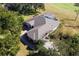 House with pool and driveway, aerial view at 39320 Harbor Hills Blvd, Lady Lake, FL 32159