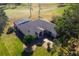 Aerial view of house, pool, and landscaped yard at 39320 Harbor Hills Blvd, Lady Lake, FL 32159