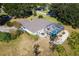 Aerial view of house with pool and screened patio at 39320 Harbor Hills Blvd, Lady Lake, FL 32159