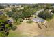 House nestled on a spacious lot with mature trees at 39320 Harbor Hills Blvd, Lady Lake, FL 32159