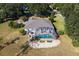 Aerial view of home with pool and screened enclosure at 39320 Harbor Hills Blvd, Lady Lake, FL 32159