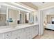 Double vanity bathroom with a large mirror and a shower at 39320 Harbor Hills Blvd, Lady Lake, FL 32159