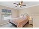 Bedroom with ceiling fan and large window at 39320 Harbor Hills Blvd, Lady Lake, FL 32159