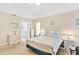 Comfortable bedroom with a queen-size bed and ensuite bathroom at 39320 Harbor Hills Blvd, Lady Lake, FL 32159
