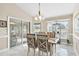 Bright dining room with table and chairs, access to a patio at 39320 Harbor Hills Blvd, Lady Lake, FL 32159