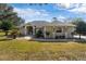 Single-story house with a paved walkway leading to the front entrance at 39320 Harbor Hills Blvd, Lady Lake, FL 32159