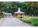 Gated community entrance with guardhouse, providing security and exclusivity at 39320 Harbor Hills Blvd, Lady Lake, FL 32159