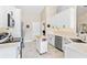 Modern kitchen featuring white cabinets, stainless steel appliances, and an island at 39320 Harbor Hills Blvd, Lady Lake, FL 32159