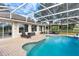 Large screened pool with patio and lounge chairs at 39320 Harbor Hills Blvd, Lady Lake, FL 32159